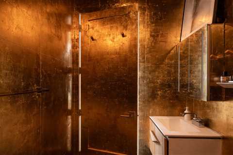 How They Pulled It Off: A Small Apartment Bathroom Dripped Out in Gold for Under $1,000
