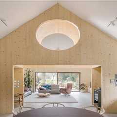Timber Structures Pull Triple Duty Inside This Belgian Home for a Retired Couple