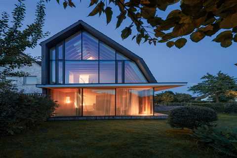 You’d Never Believe This Angular Glass Facade Stands Among Former Military Barracks